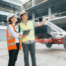 Woman engineer and man at construction site